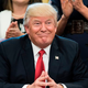 President Donald Trump sitting at his desk.